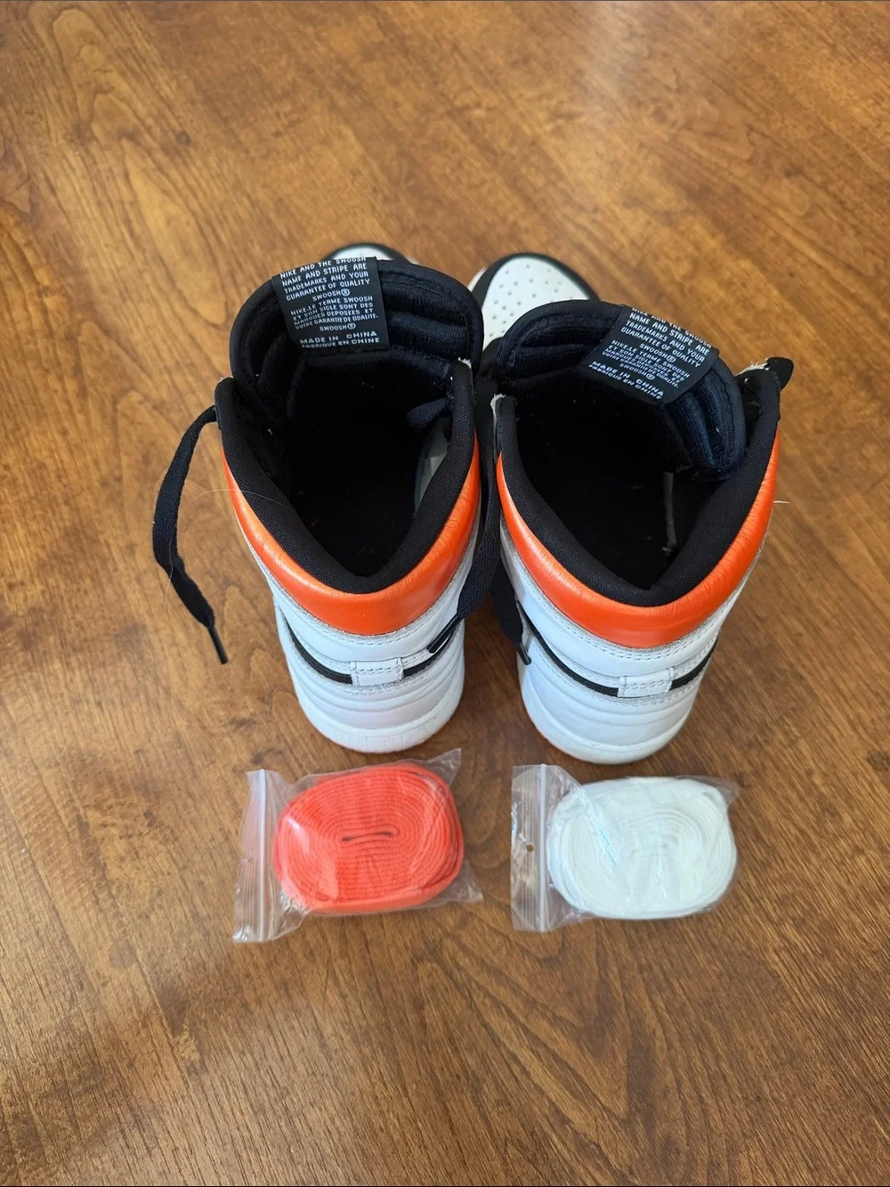 Nike High-Top Sneakers in Black, White & Orange Accents
